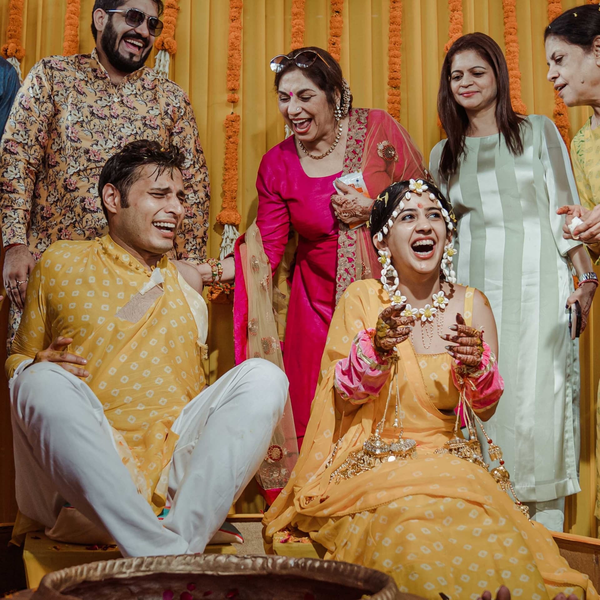 A haldi celebration amid laughter and marigolds